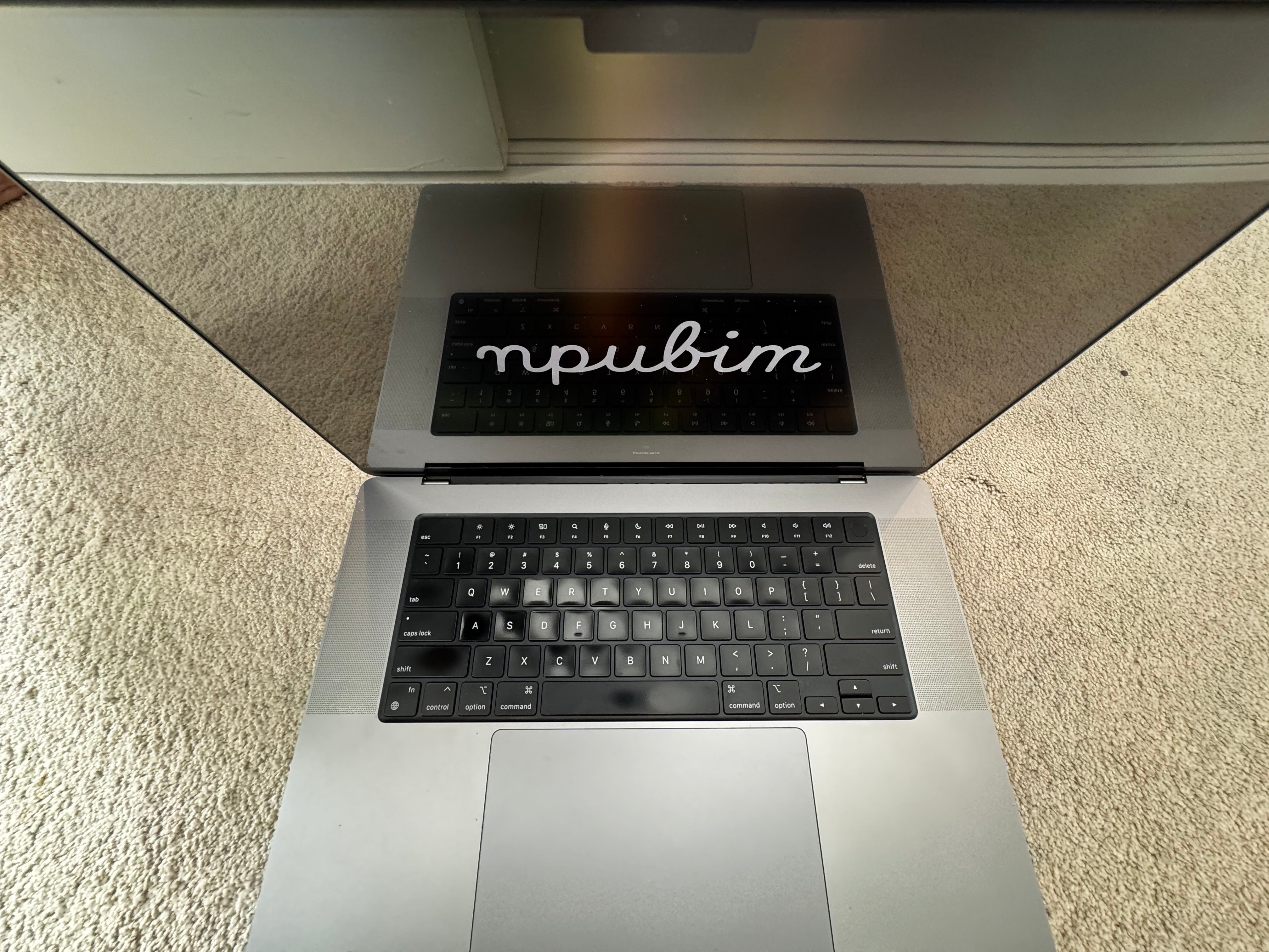 Laptop with a keyboard cover on a textured surface